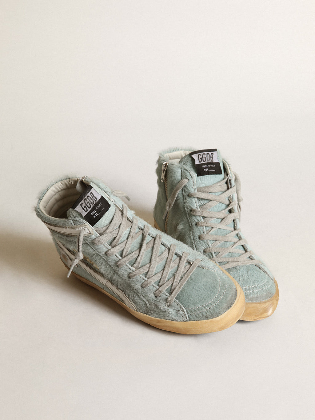 Sneaker Slide in cavallino color acquamarina con stella in pelle laminata color argento