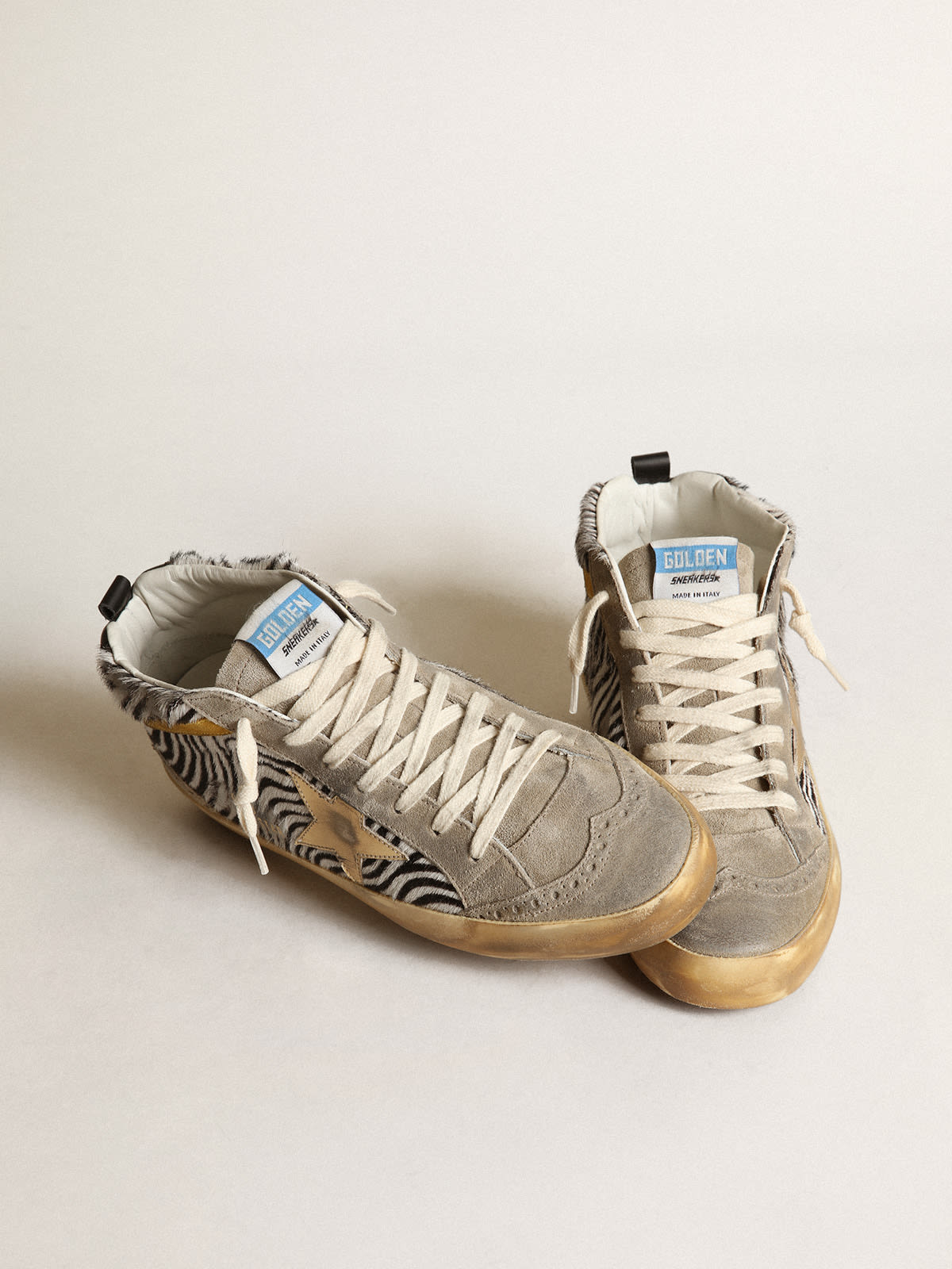 Sneaker Mid Star in cavallino zebrato con stella in pelle laminata dorata e virgola in suede color senape
