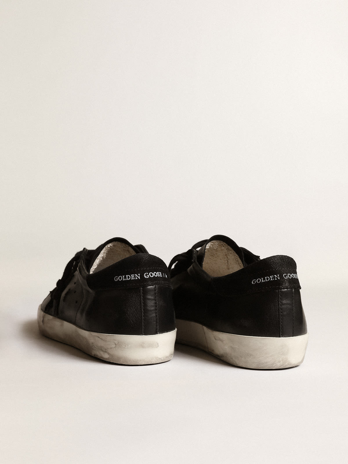 Super-Star in nappa nera con stella e talloncino in suede nero