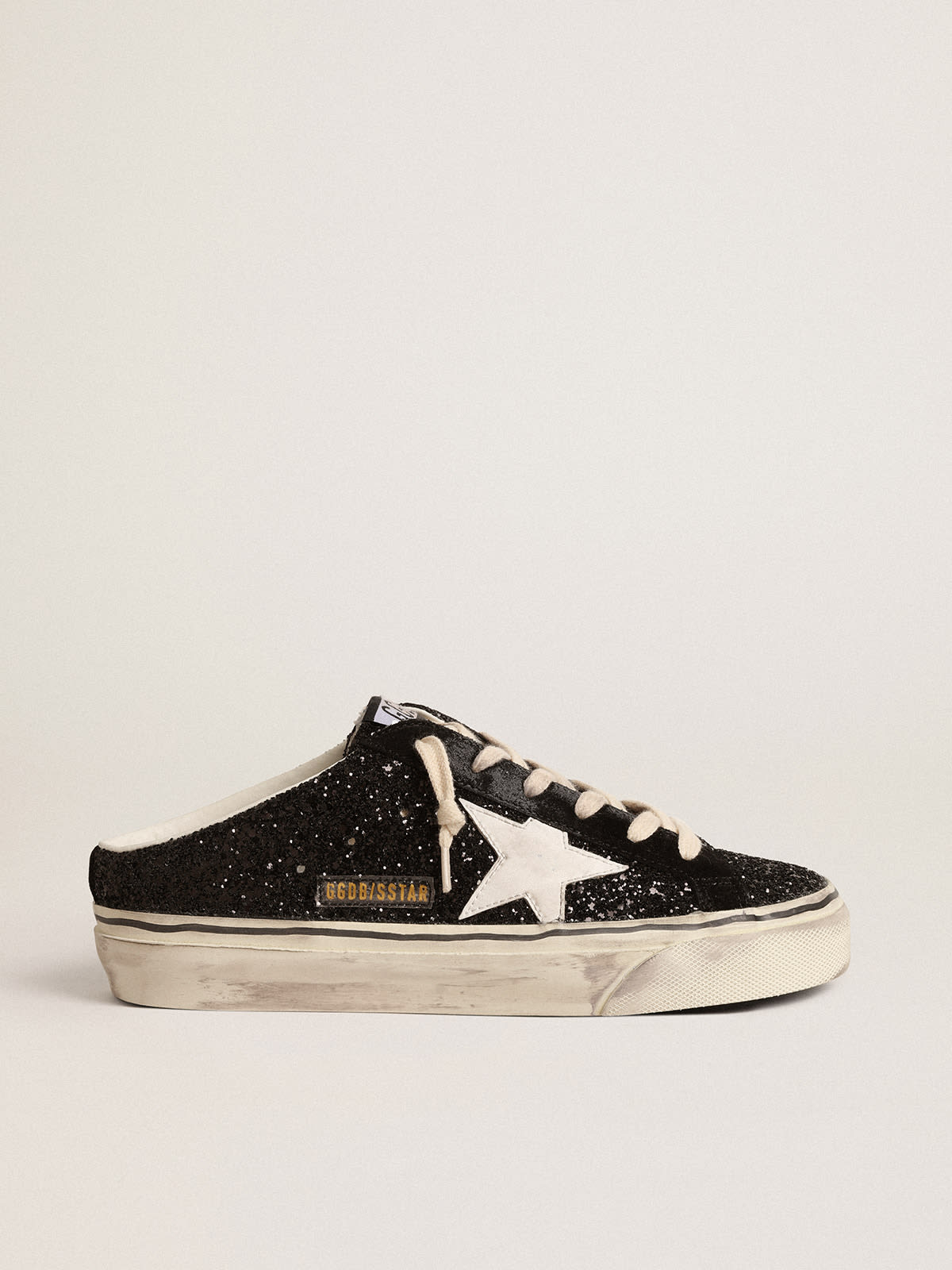 Super-Star Sabot in glitter neri con stella bio-based bianca