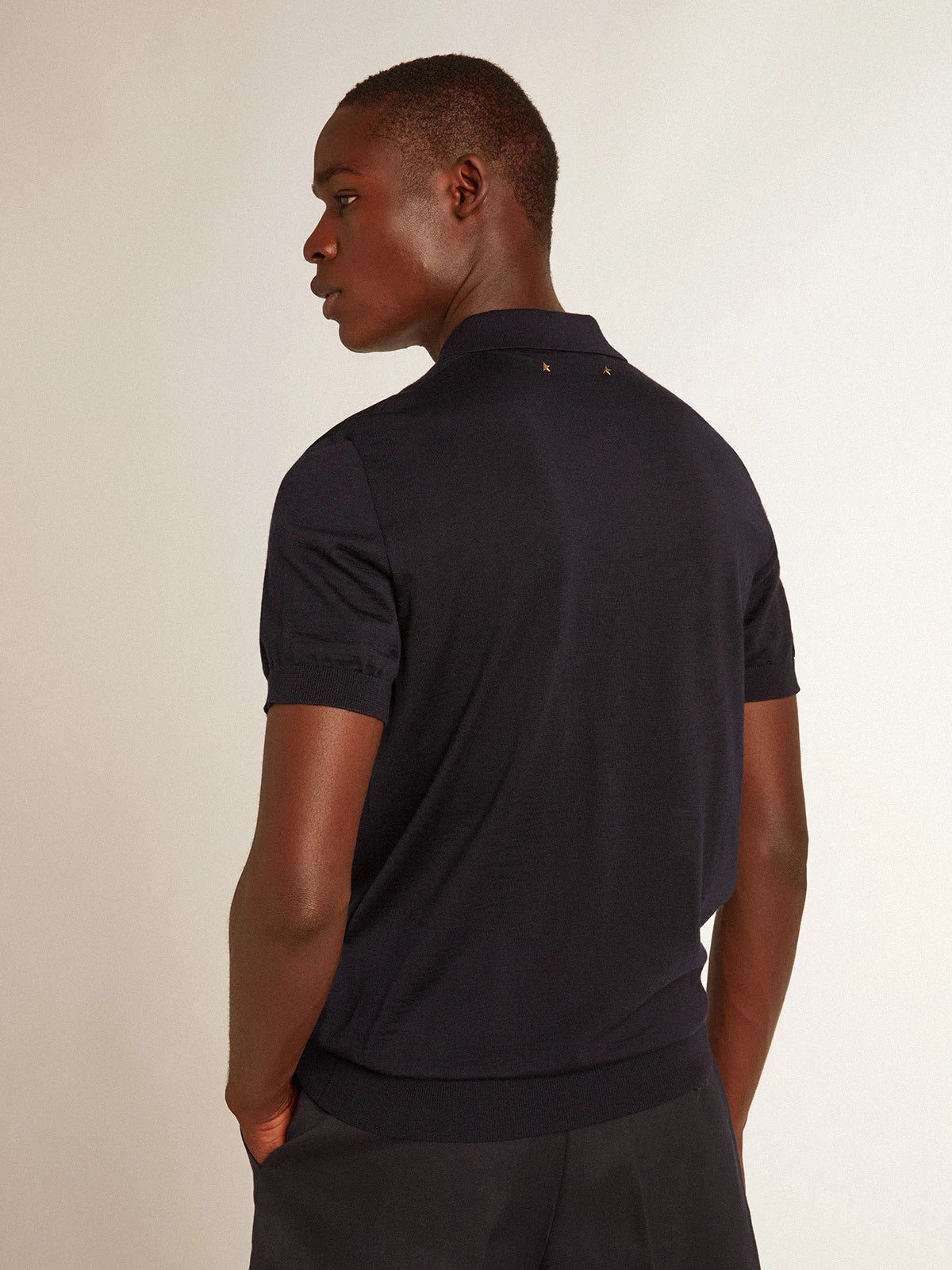 Polo maniche corte da uomo in lana merino di colore blu navy