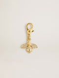 Bee-shaped charm in gold-colored brass with crystals