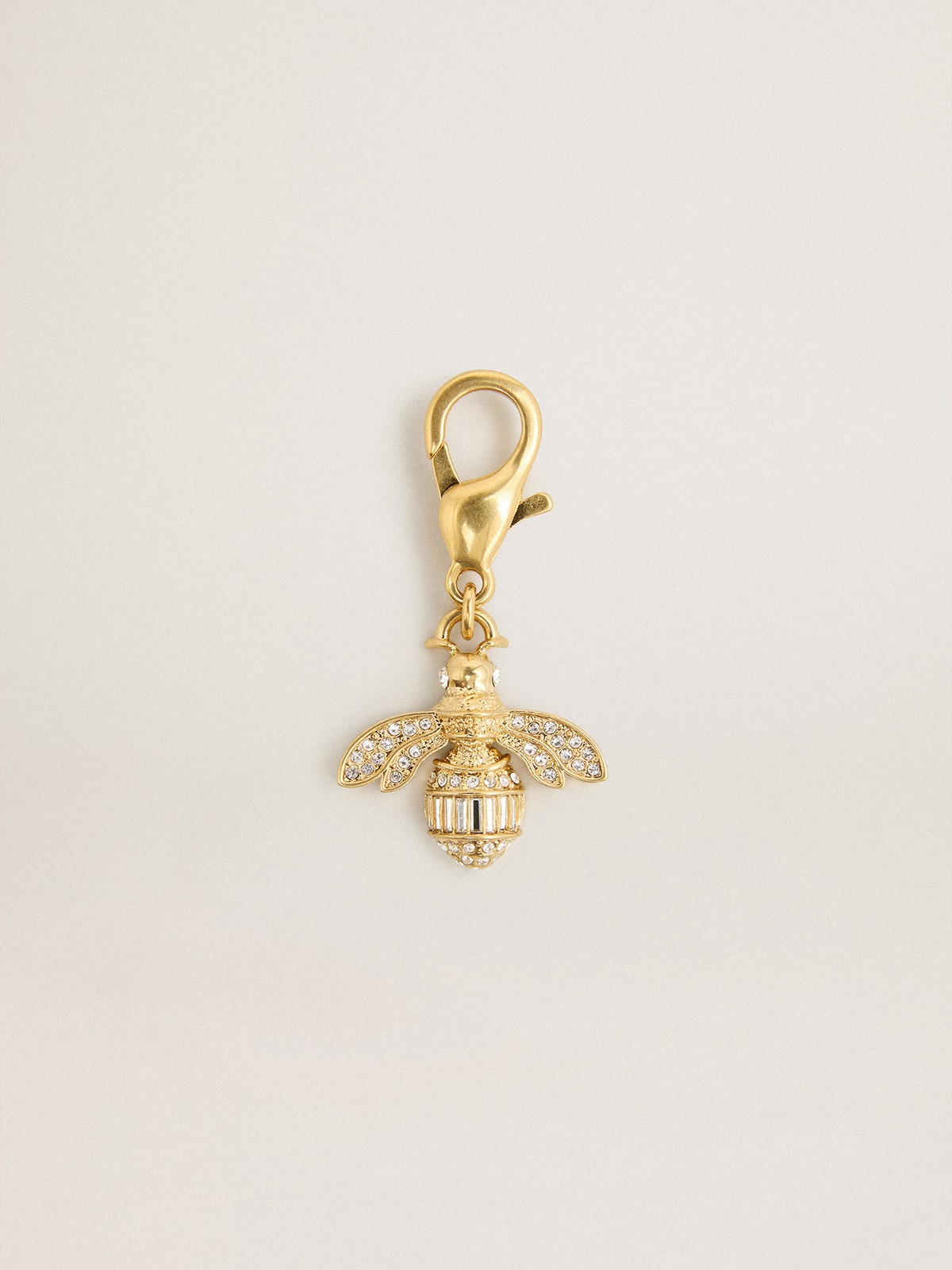 Bee-shaped charm in gold-colored brass with crystals