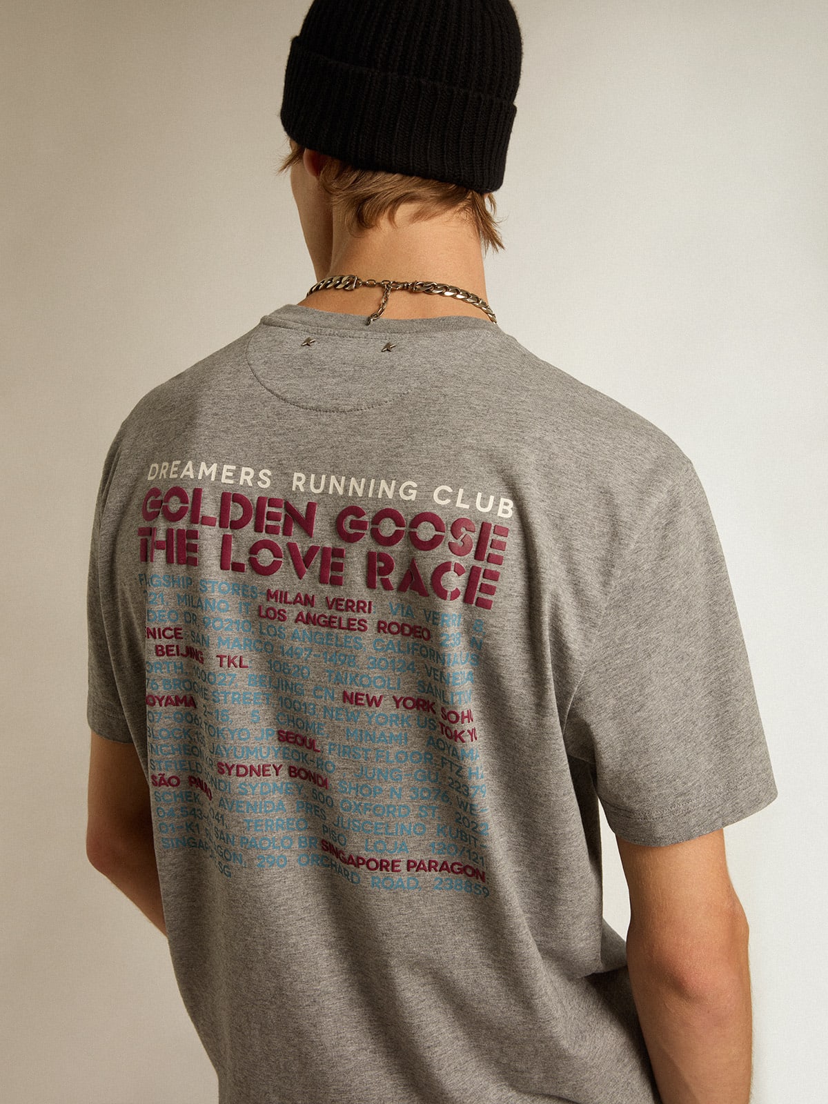 T-shirt in cotone color grigio melange con manifesto sul retro