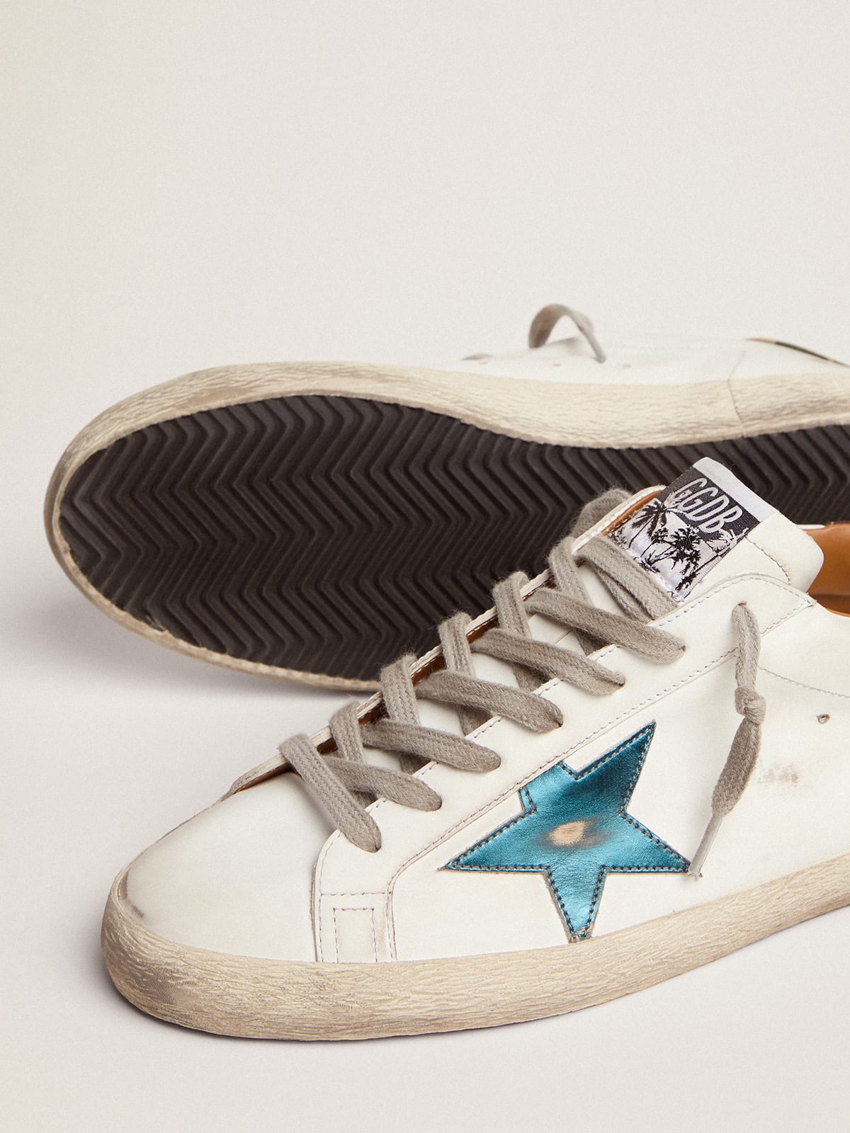 Sneaker Super-Star con stella in pelle laminata blu petrolio e talloncino in tessuto ripstop camou