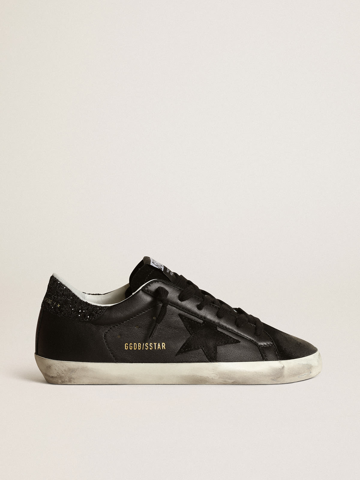 Sneaker Super-Star in nappa nera con stella in suede nero e talloncino in glitter neri
