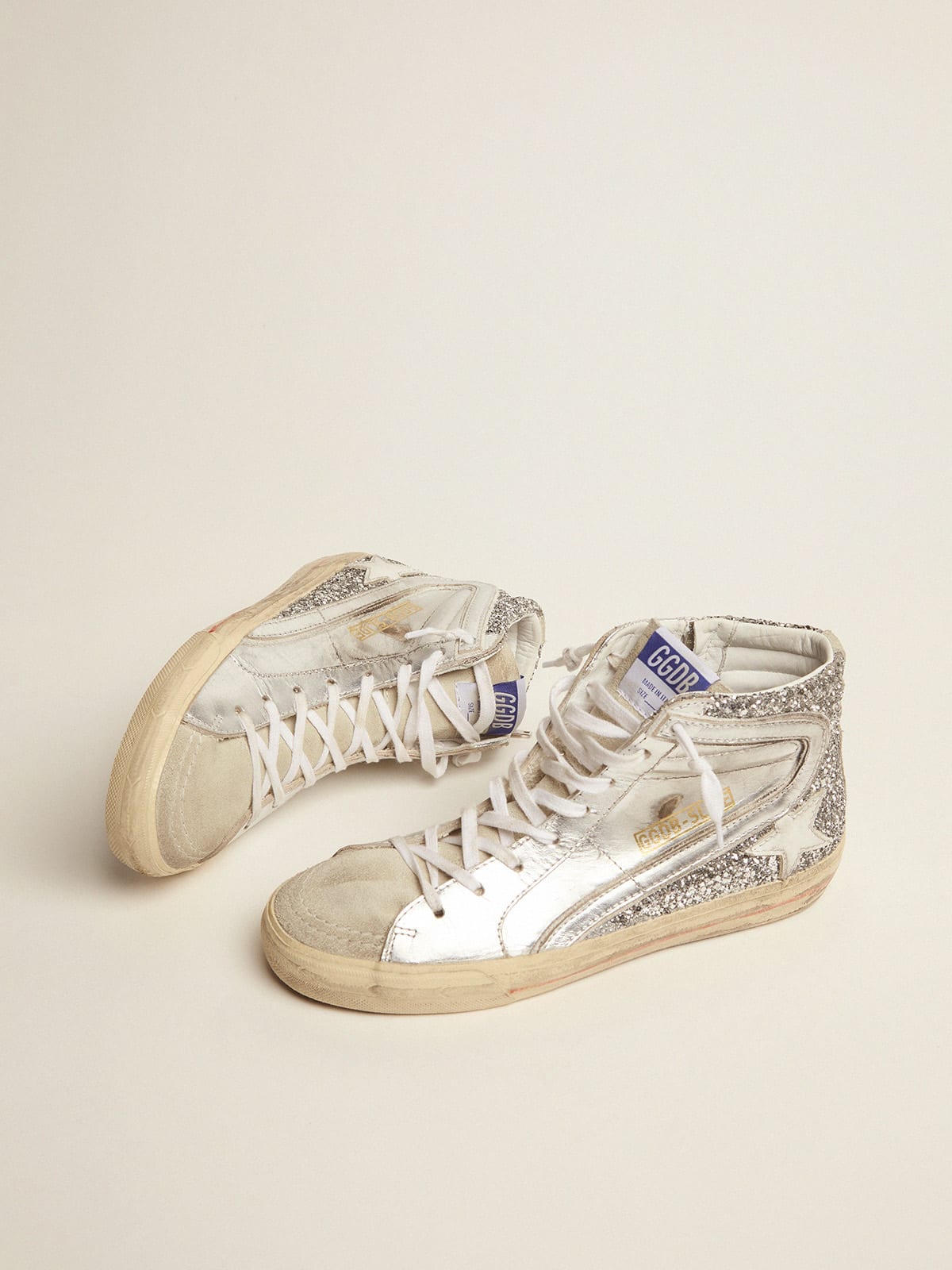 Sneaker Slide con tomaia in pelle laminata e glitter argento