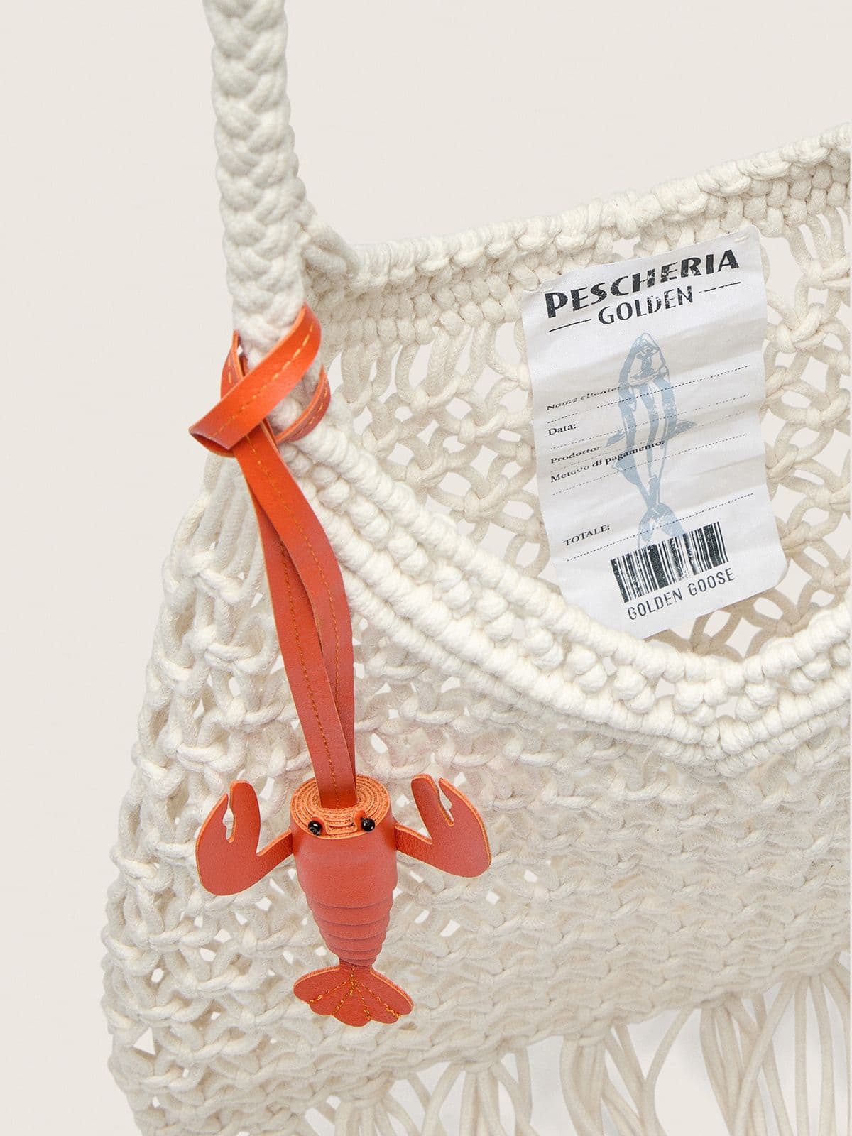 Women's macramé bag in butter-colored cotton with a leather lobster charm