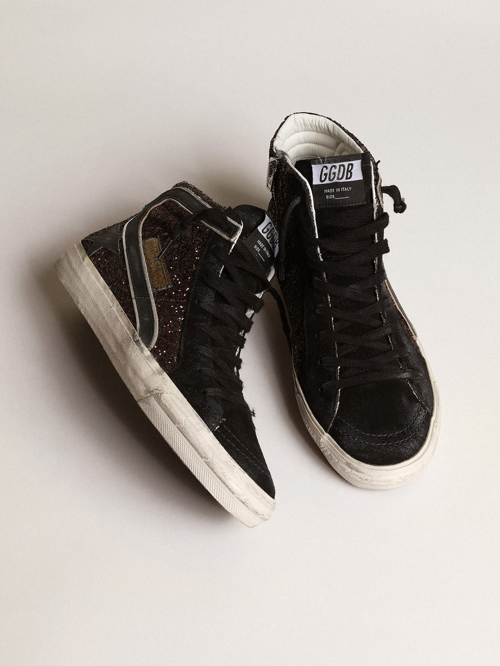 Slide in glitter marroni con stella e virgola in pelle nera