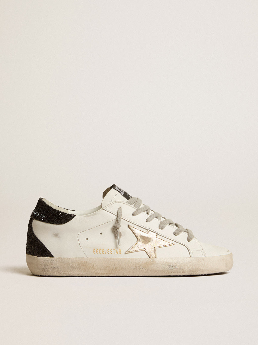 Super-Star con stella oro e talloncino in glitter nero