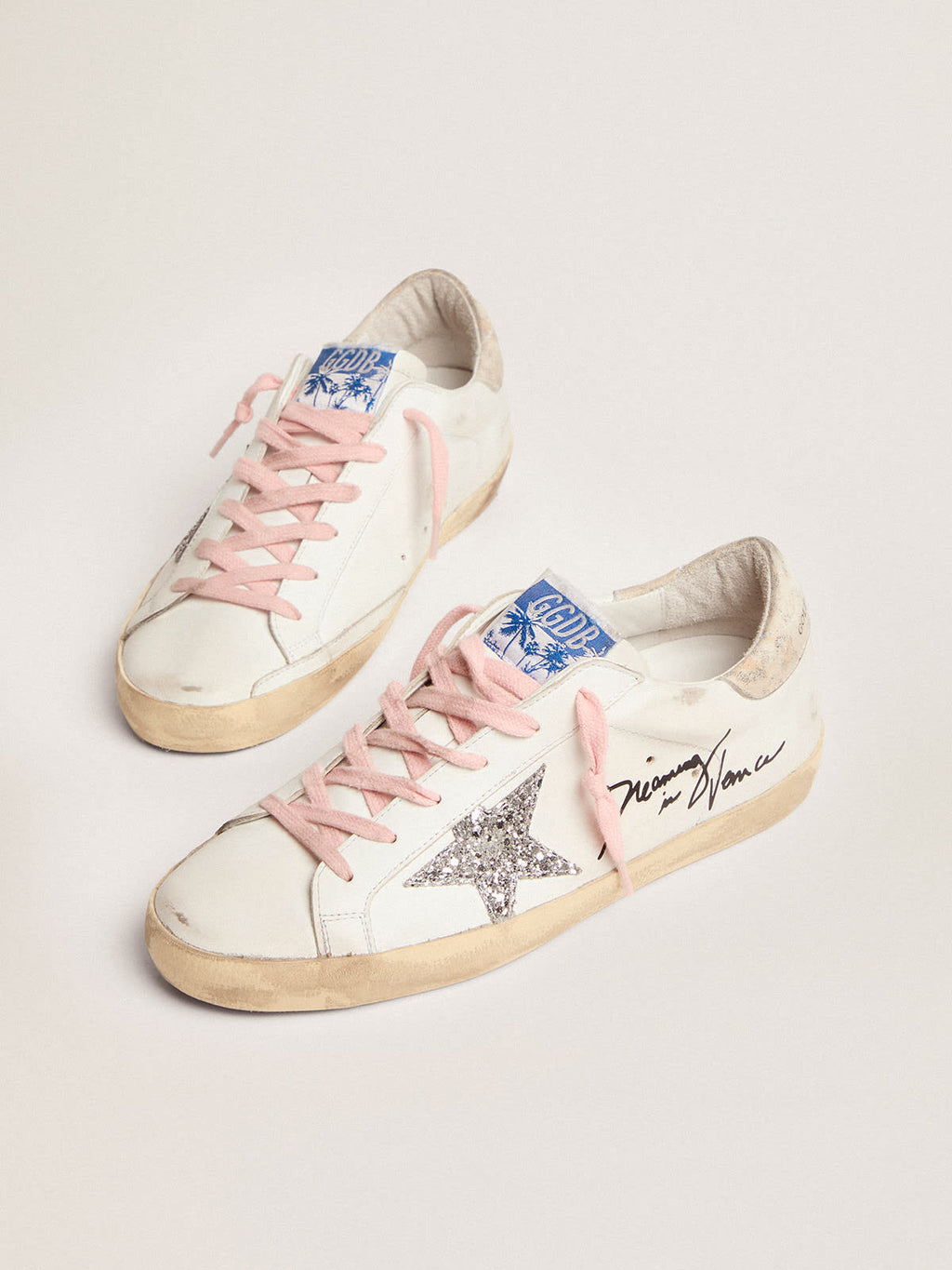 Sneaker Super-Star con stella in glitter argento e talloncino in pelle con stampa leopardata