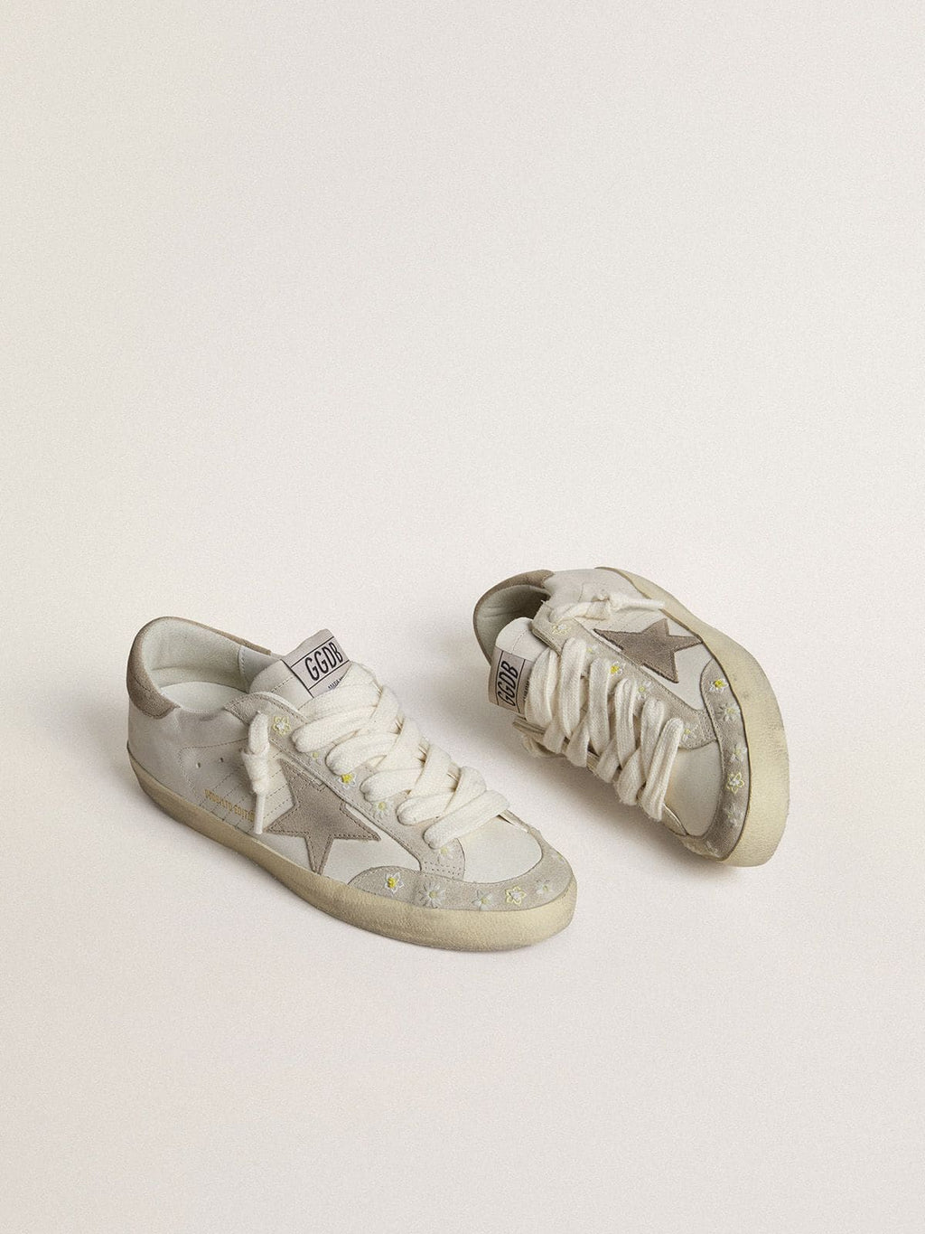 Women’s Super-Star LTD with beige suede star and heel tab and floral embroidery