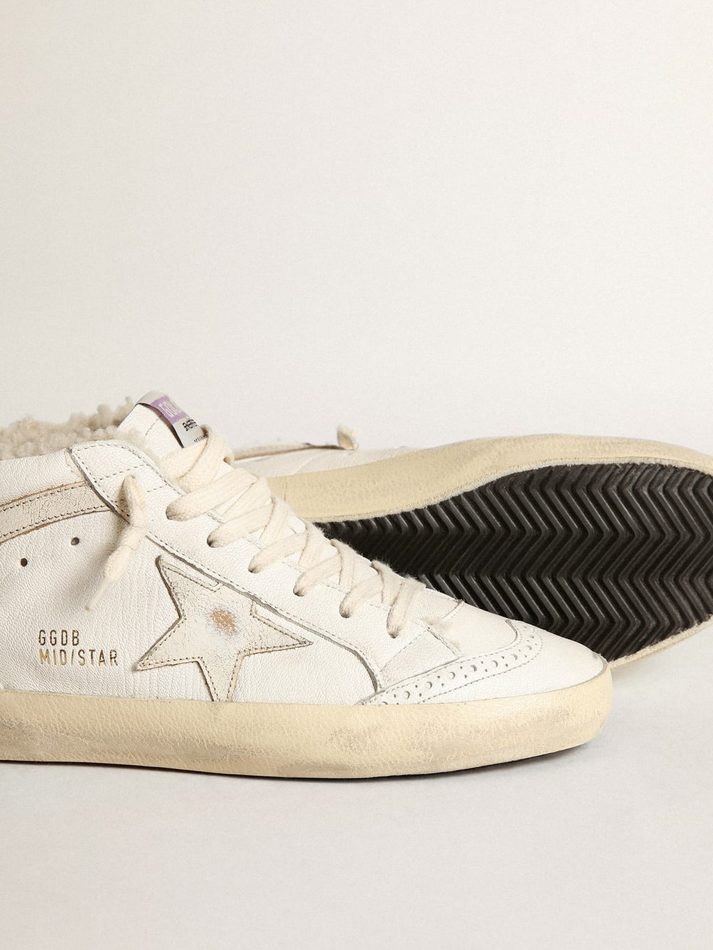 Mid Star in nappa con stella e virgola in pelle lucida bianca