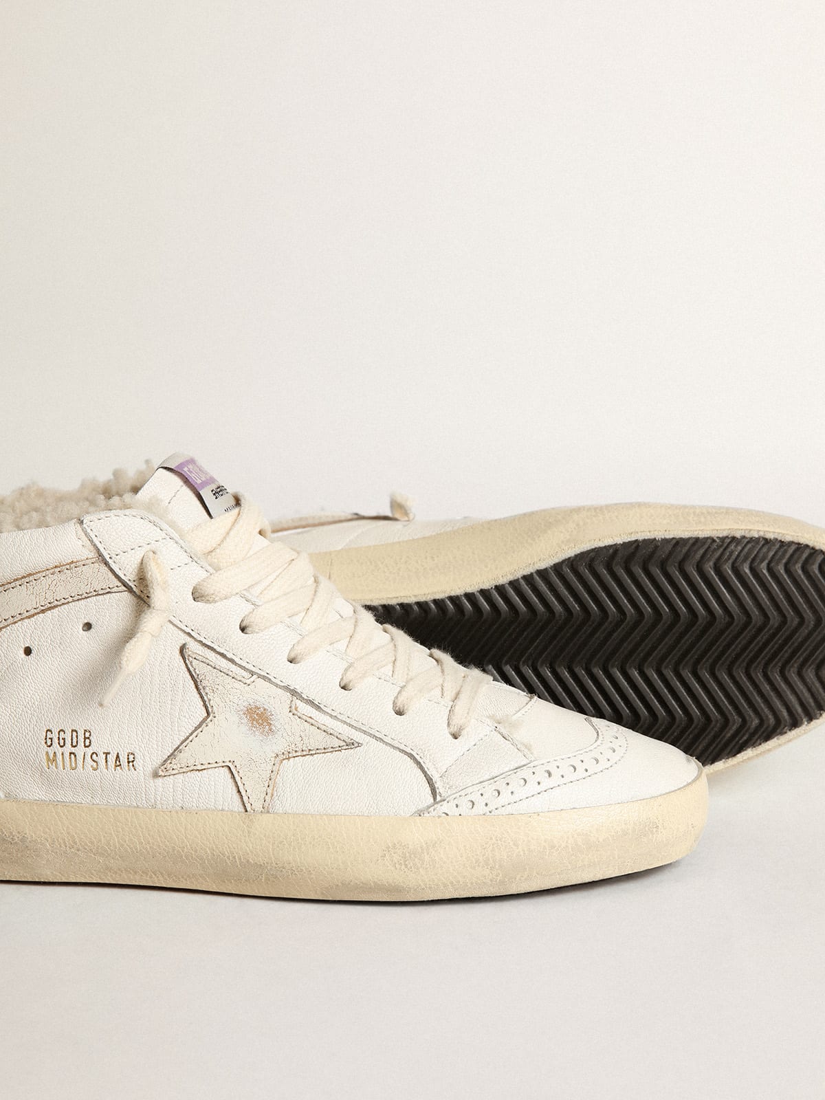 Mid Star in nappa con stella e virgola in pelle lucida bianca