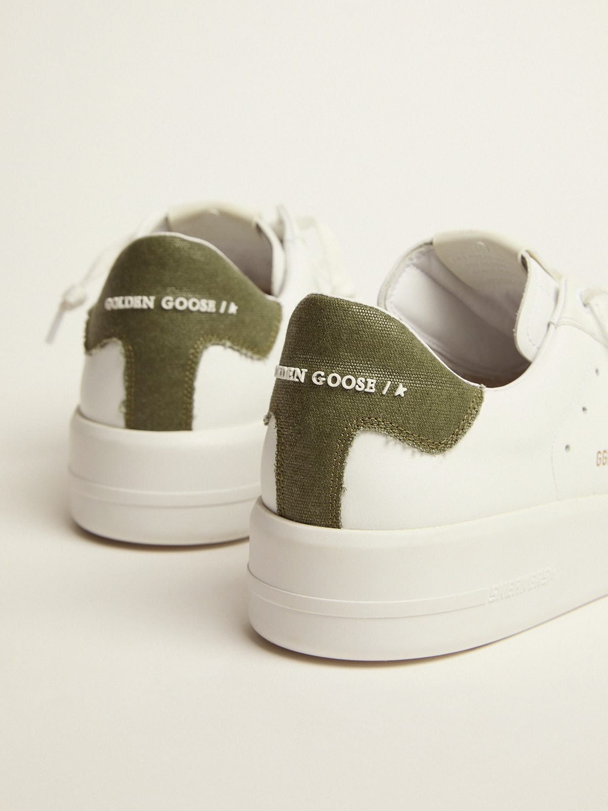 Sneaker Purestar in pelle bianca e talloncino in canvas verde
