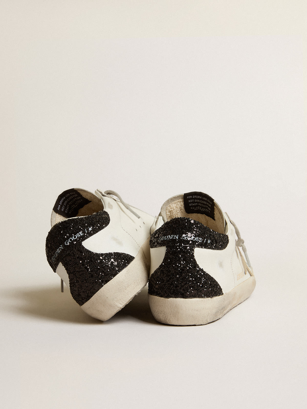 Super-Star con stella oro e talloncino in glitter nero
