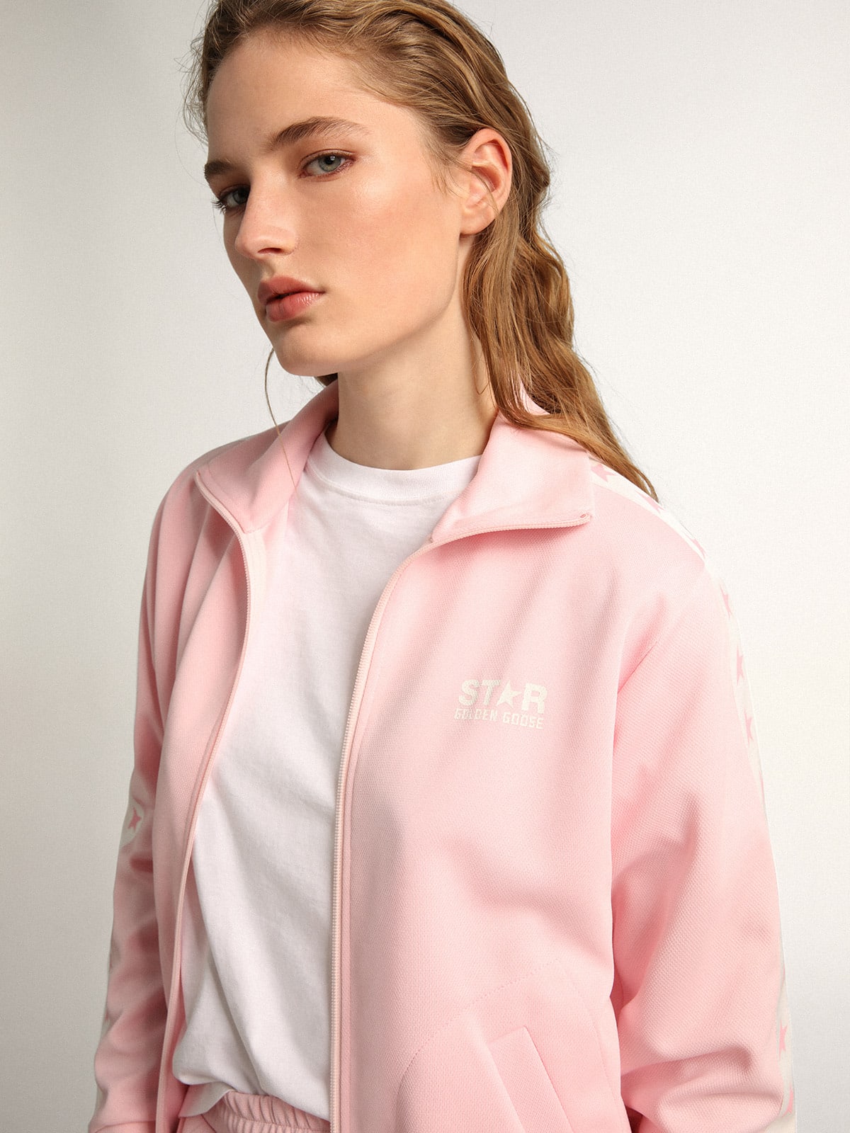 Felpa con zip da donna di colore rosa con stelle rosa a contrasto