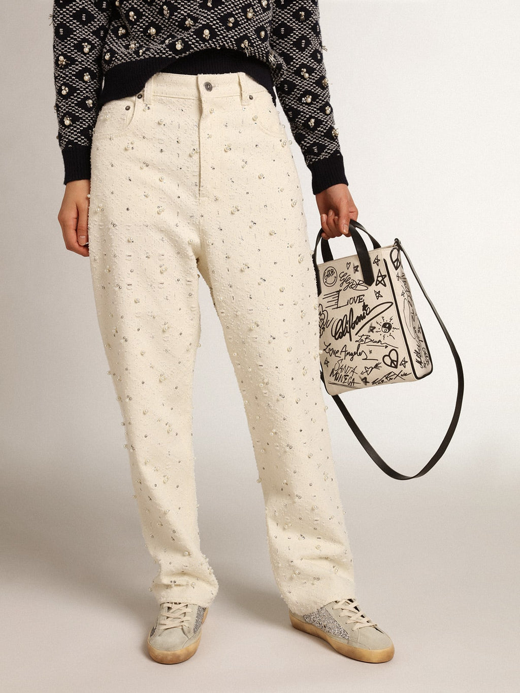 Jeans Kim Collezione Journey in cotone color bianco sporco con motivi a rombi e applicazione di perle e cristalli