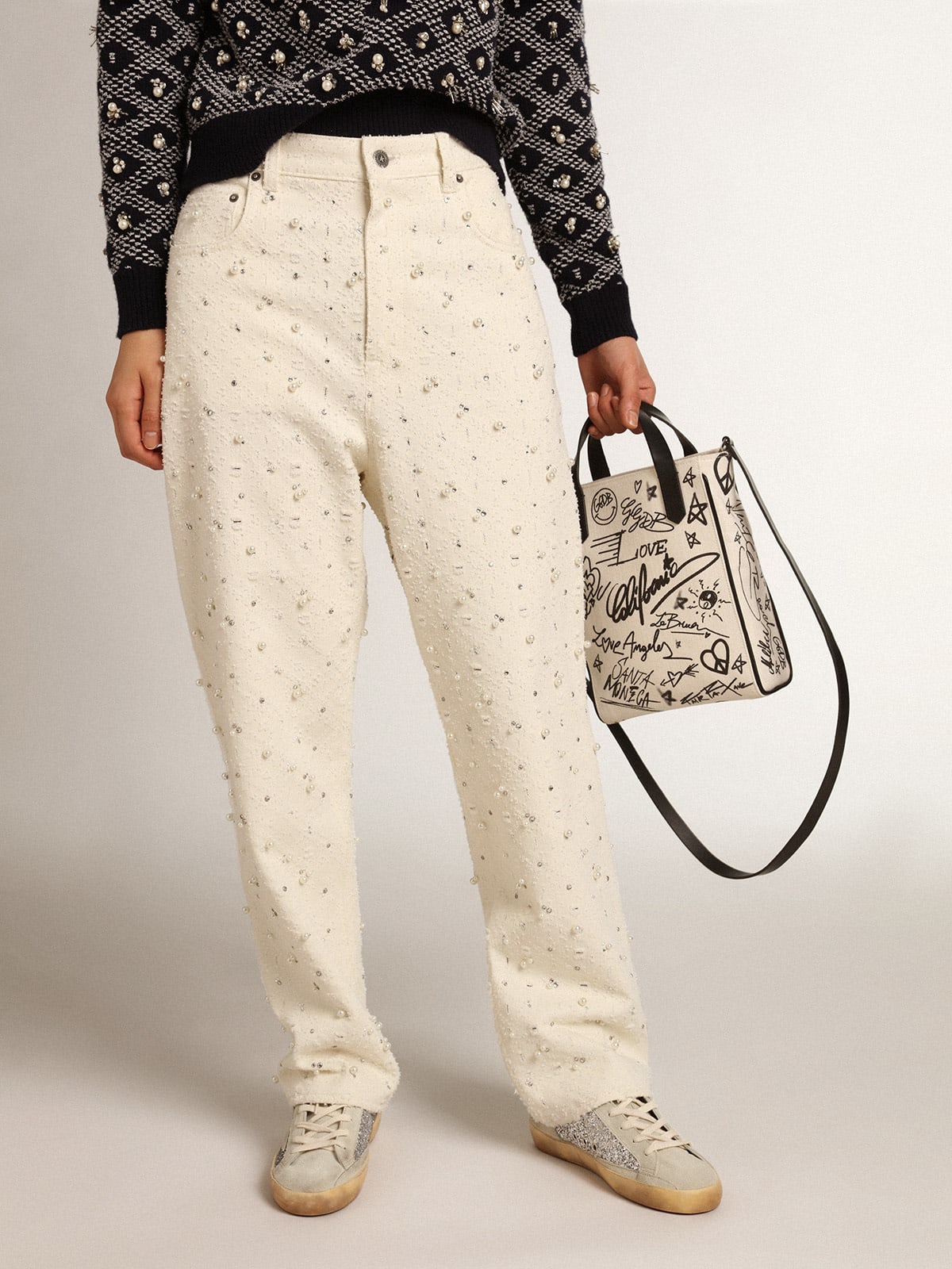 Jeans Kim Collezione Journey in cotone color bianco sporco con motivi a rombi e applicazione di perle e cristalli