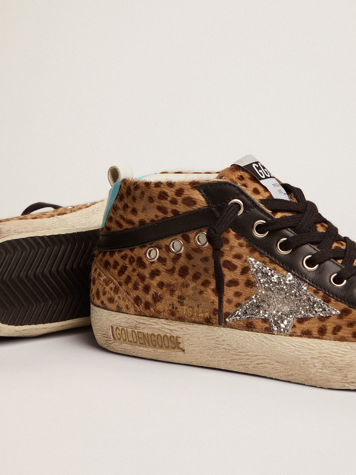 Sneaker Mid Star in cavallino con stampa animalier e stella in glitter argento