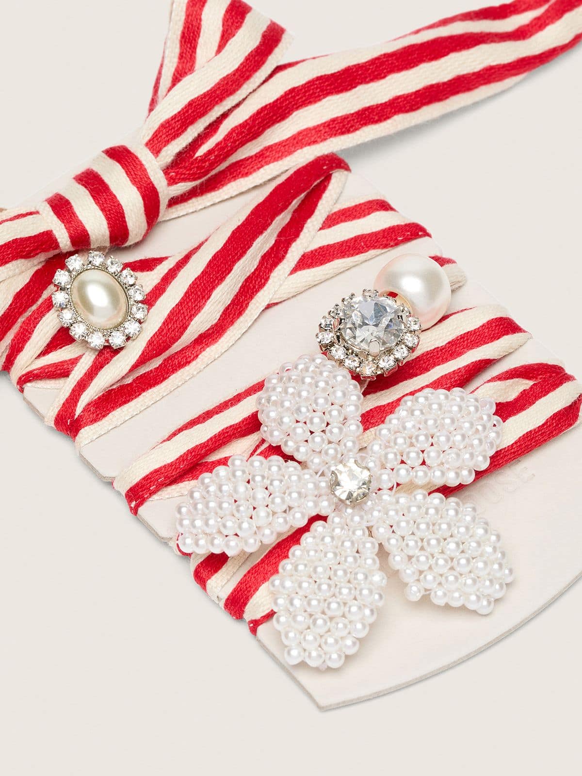 Skins "Playful" red and beige striped laces embellished with charms