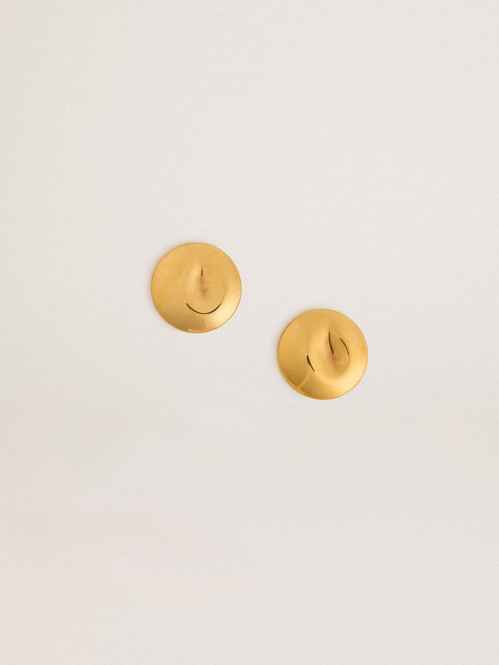 Gold circular earrings