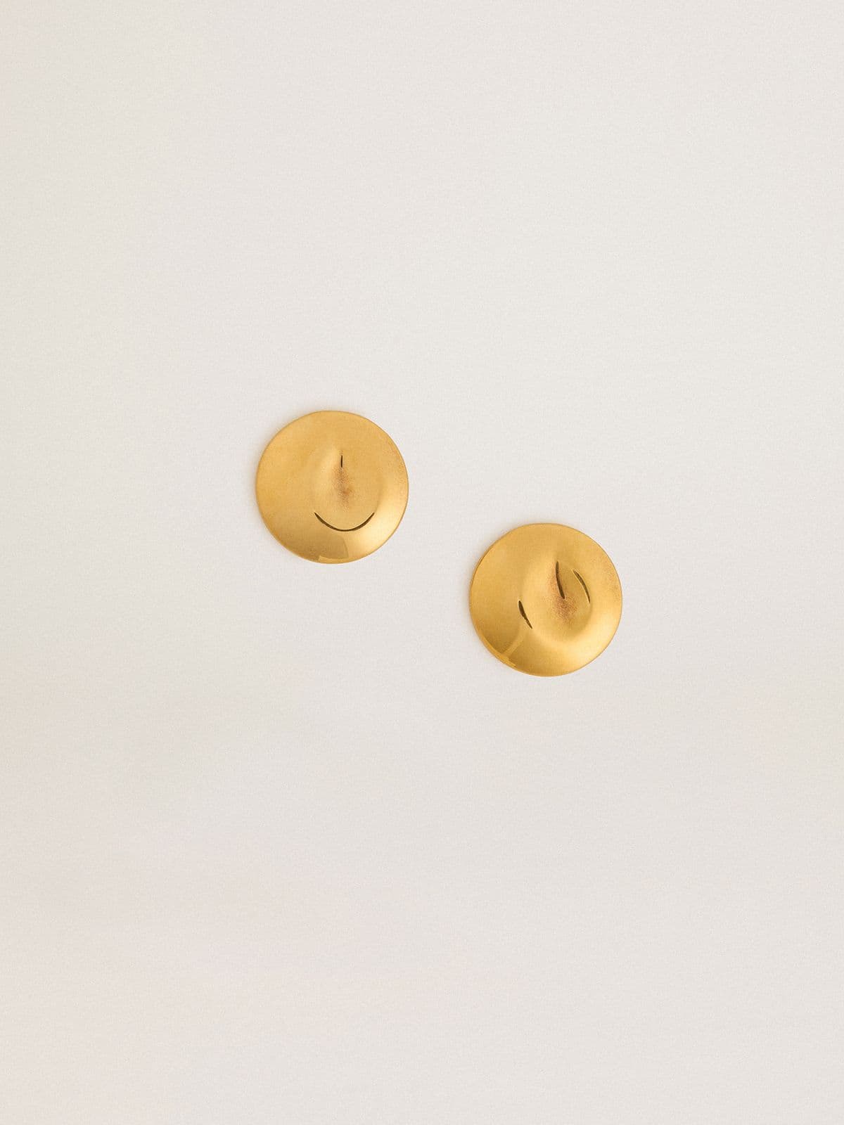 Gold circular earrings