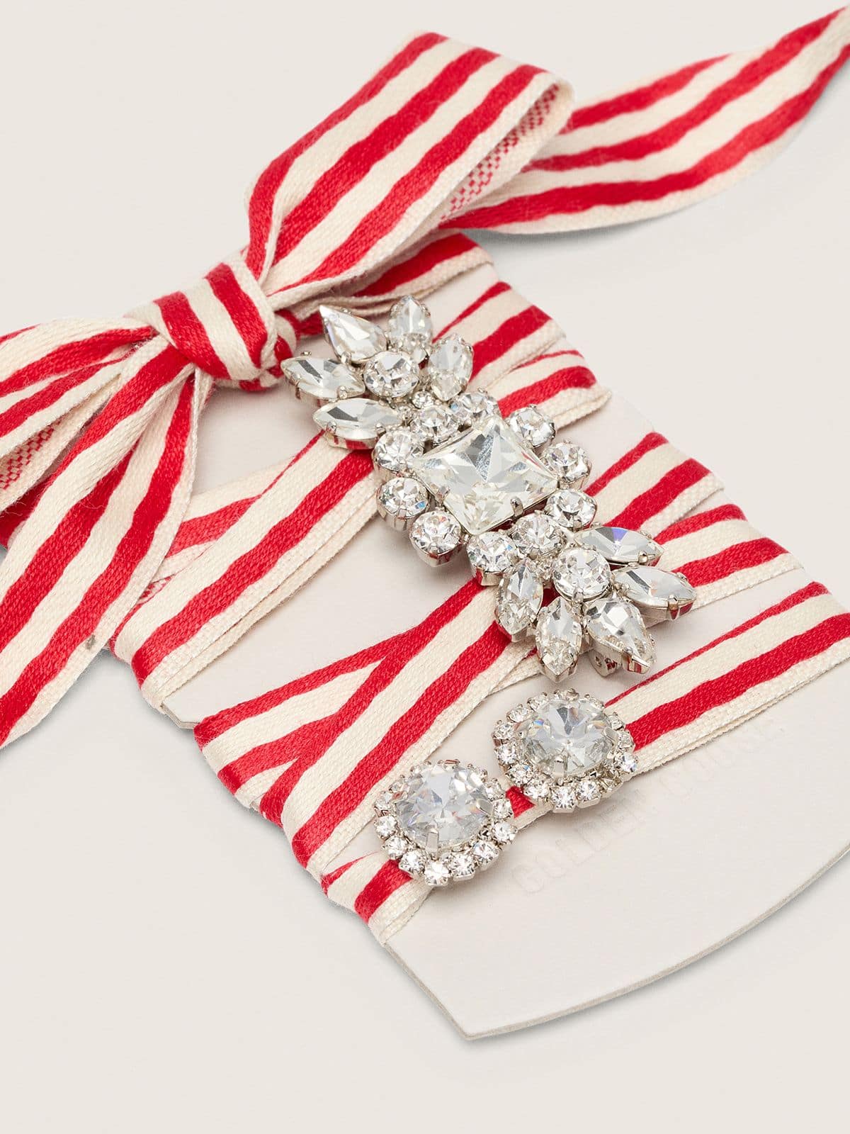 Skins "Playful" red and beige striped laces embellished with two charms