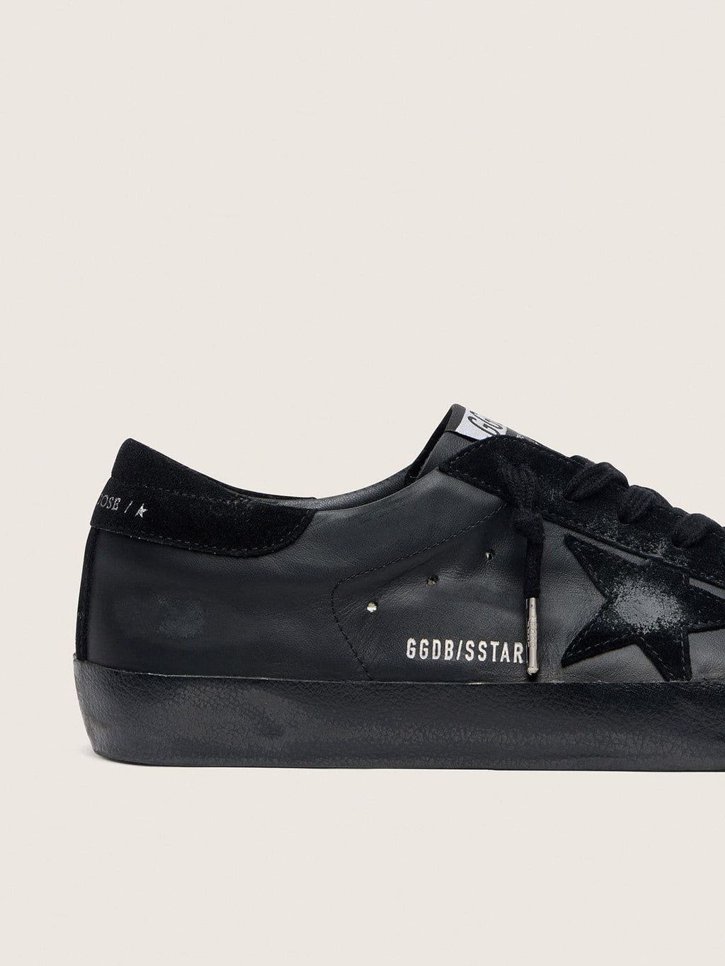 Men's Super-Star in black nappa with black suede star and heel tab