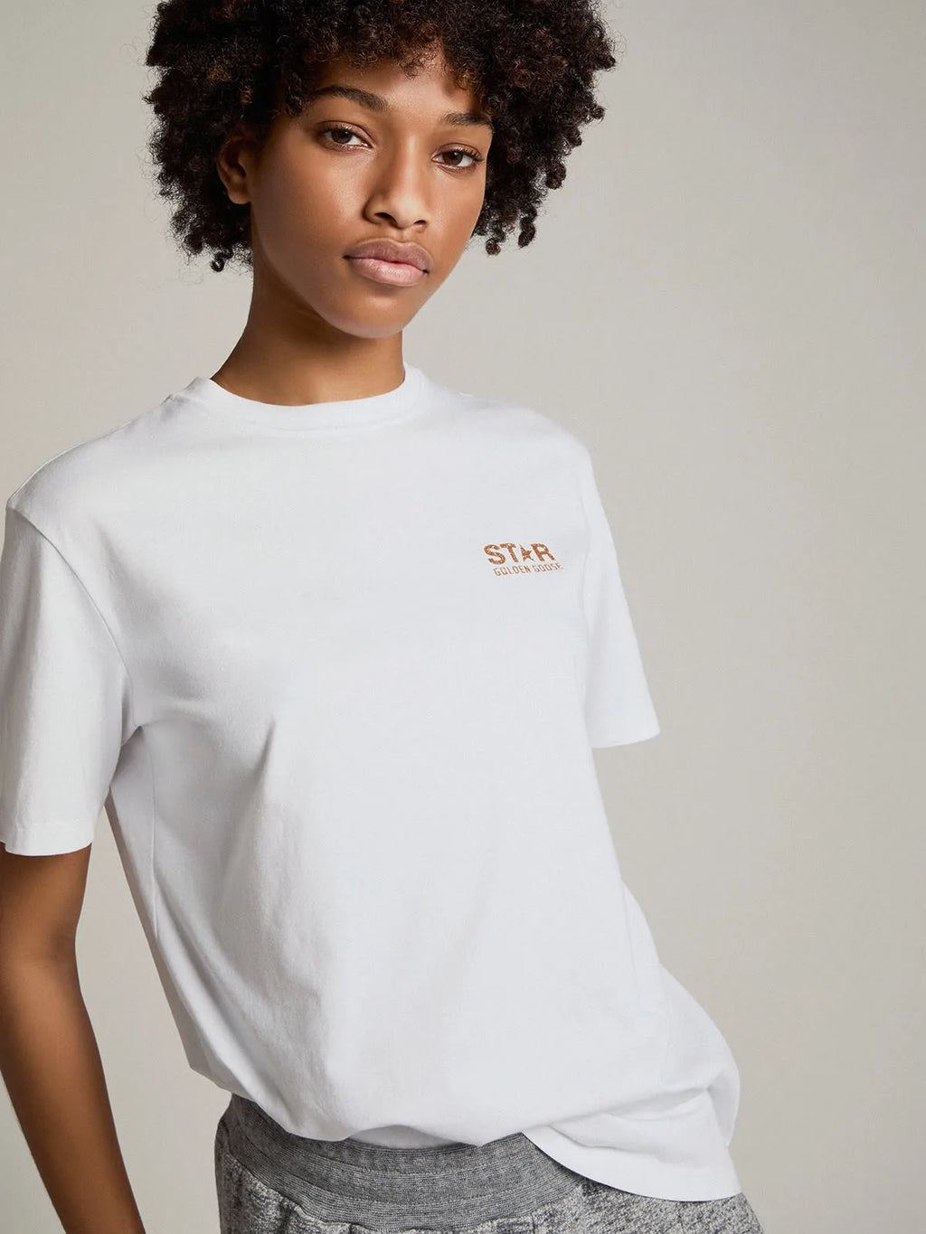T-shirt bianca Collezion Star con logo e stella in glitter dorati