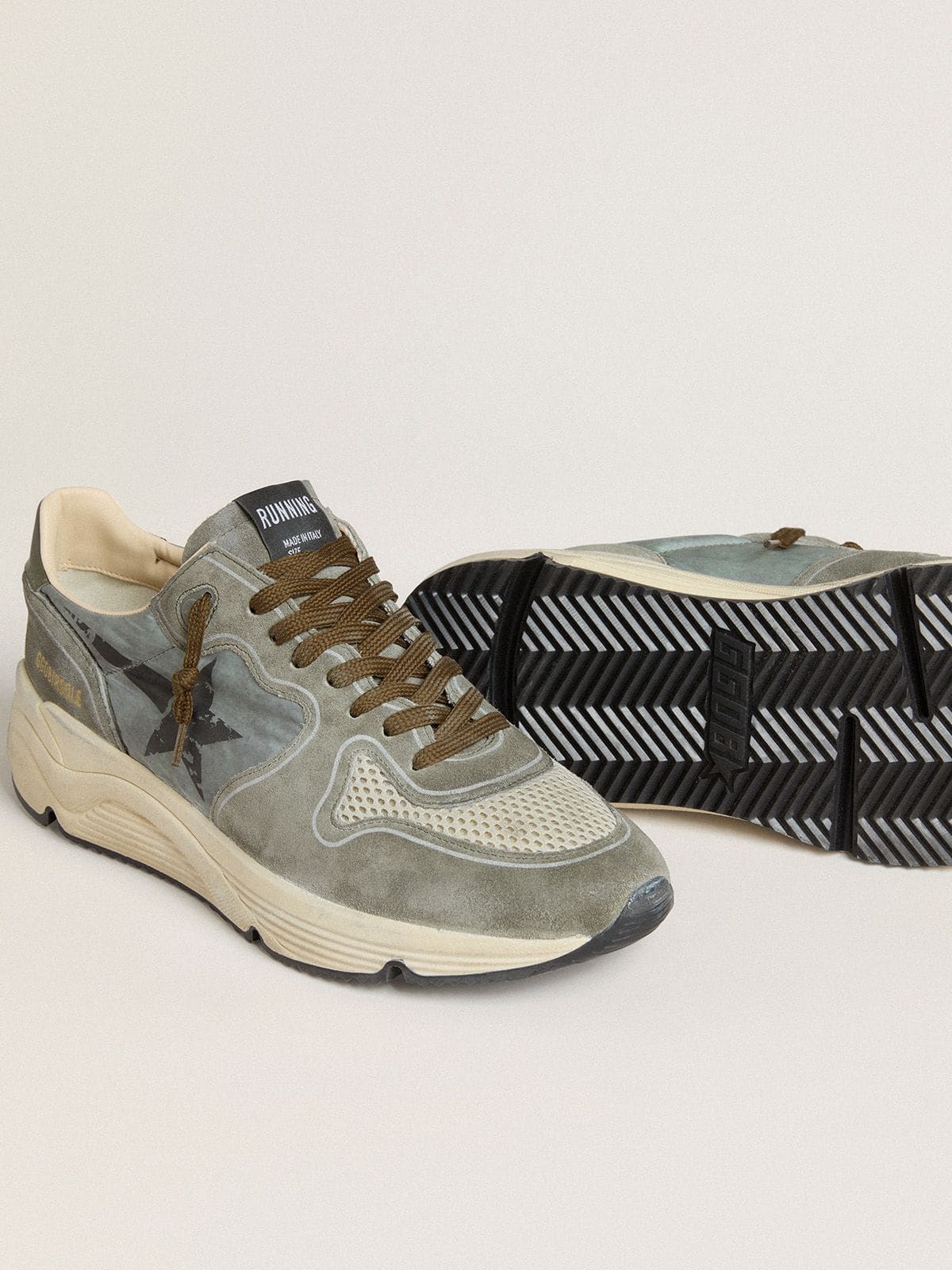 Men's Running Sole in light blue nylon with black star and green leather heel tab