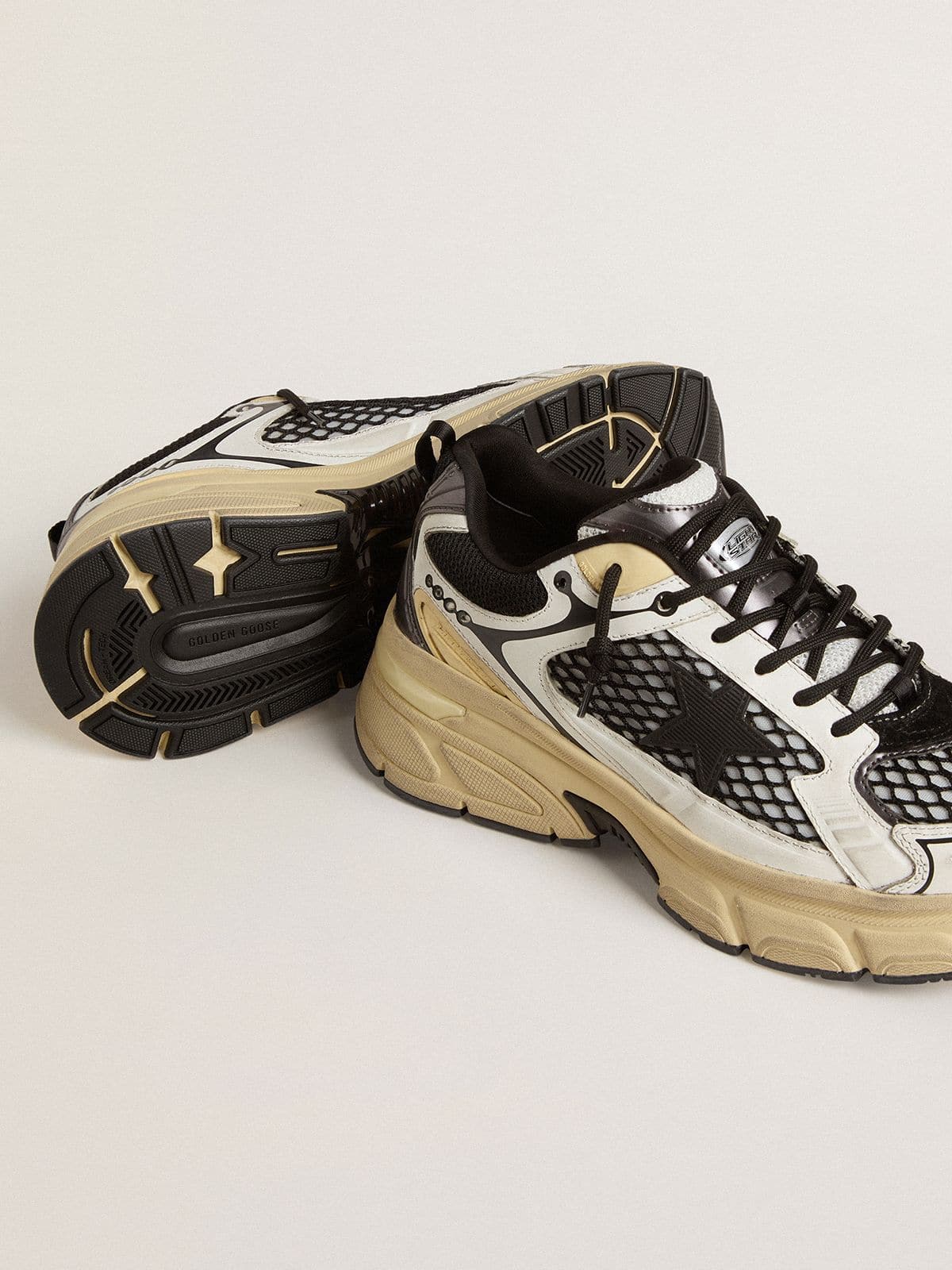 Women’s Lightstar in white leather and black mesh with black TPU star