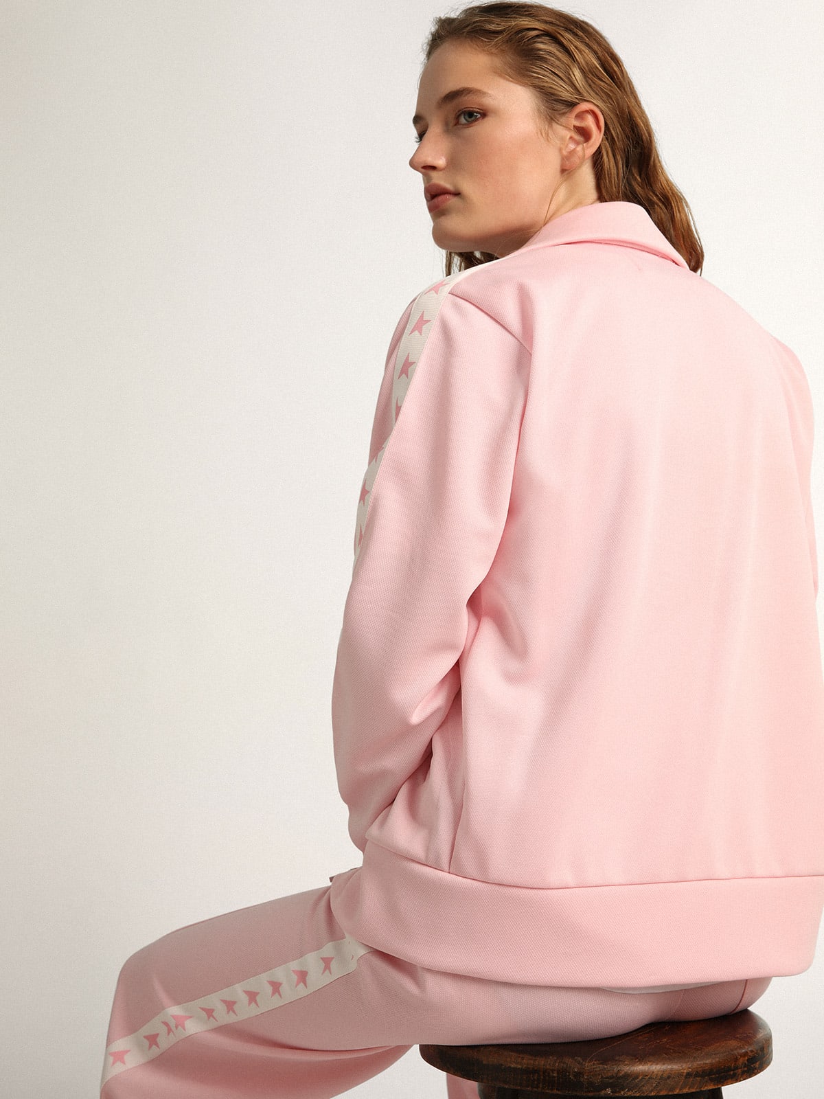 Felpa con zip da donna di colore rosa con stelle rosa a contrasto