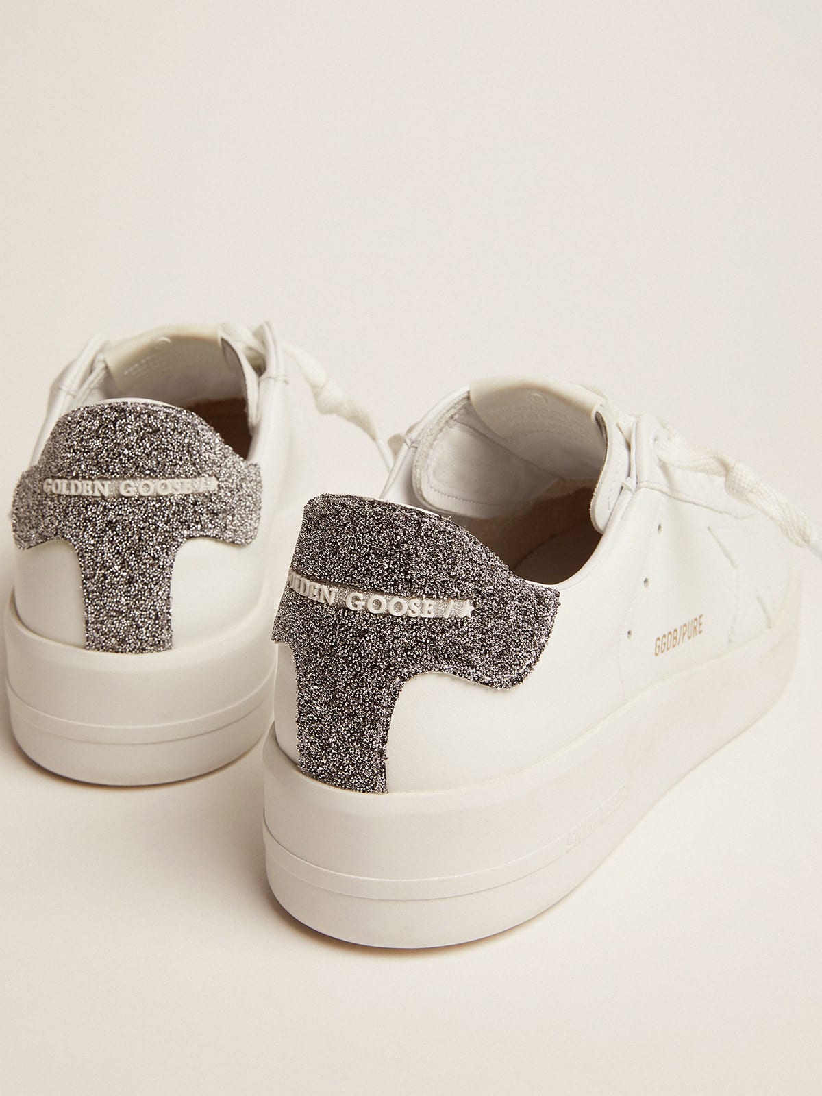 Sneaker Purestar in pelle bianca con talloncino in cristalli Swarovski argento