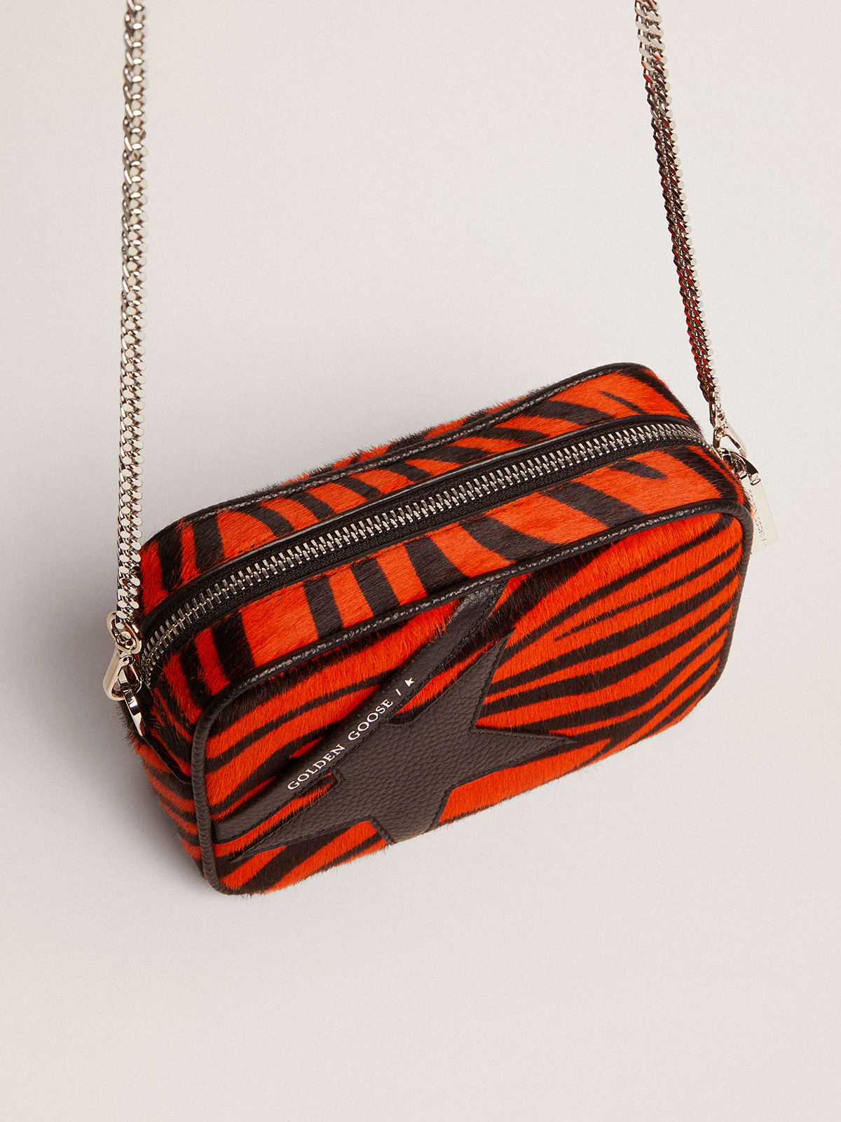 Borsa Mini Star Bag in cavallino tigrato color arancione e stella in pelle nera