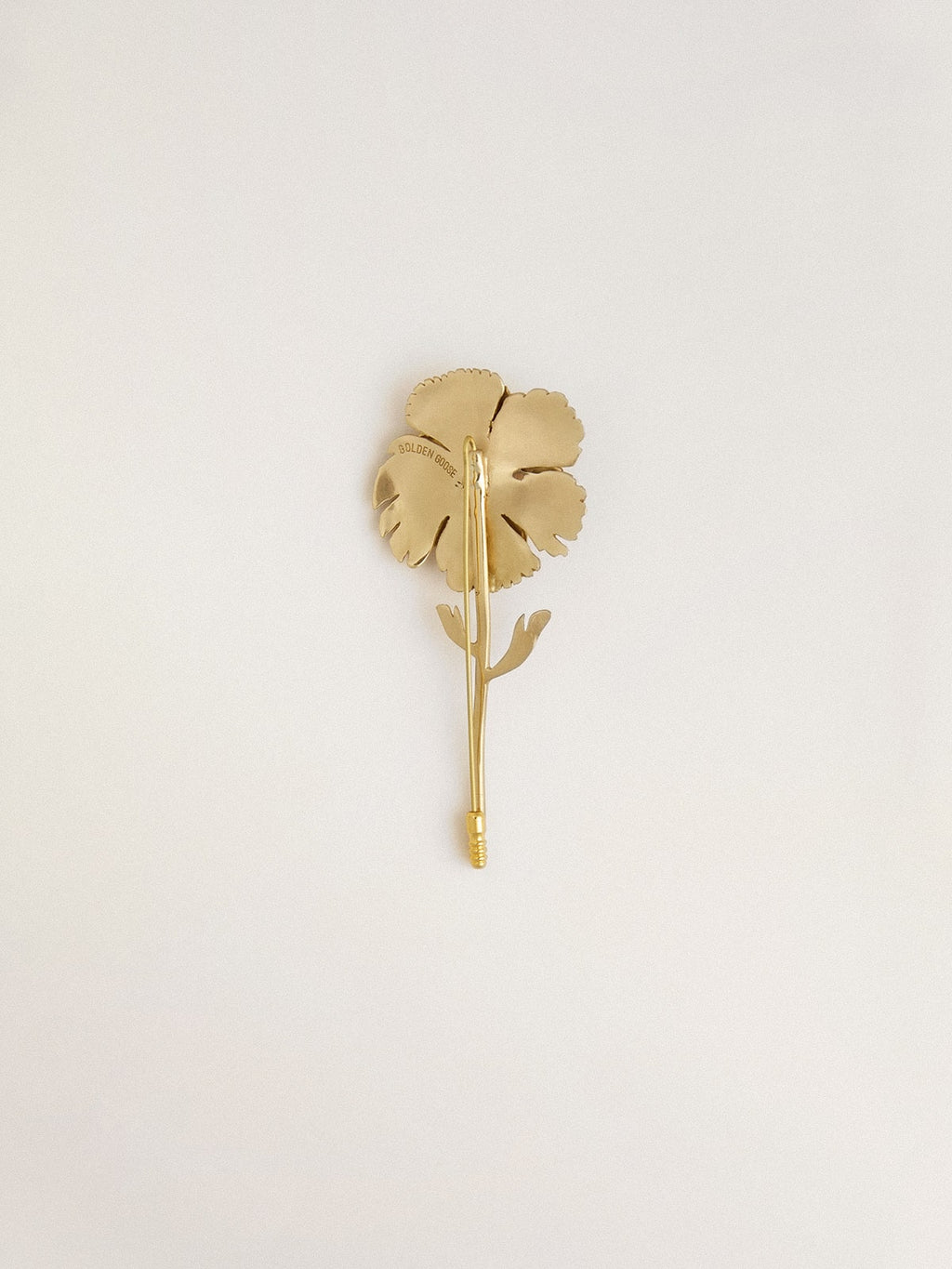 Gold pin with floral design
