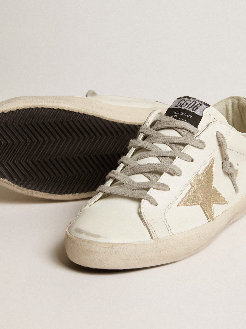 Super-Star con stella oro e talloncino in glitter nero