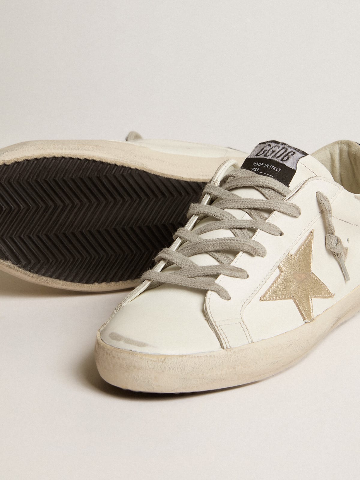 Super-Star con stella oro e talloncino in glitter nero