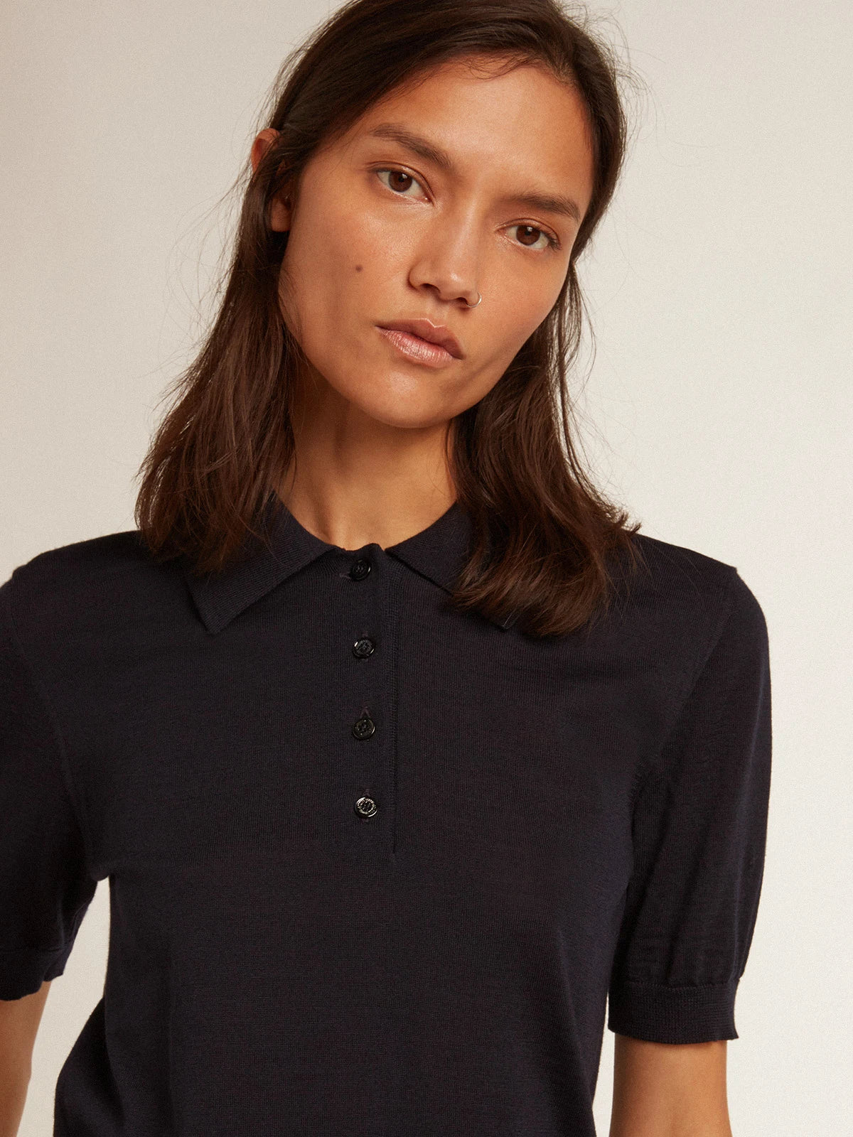 Polo da donna in lana merino di colore blu navy