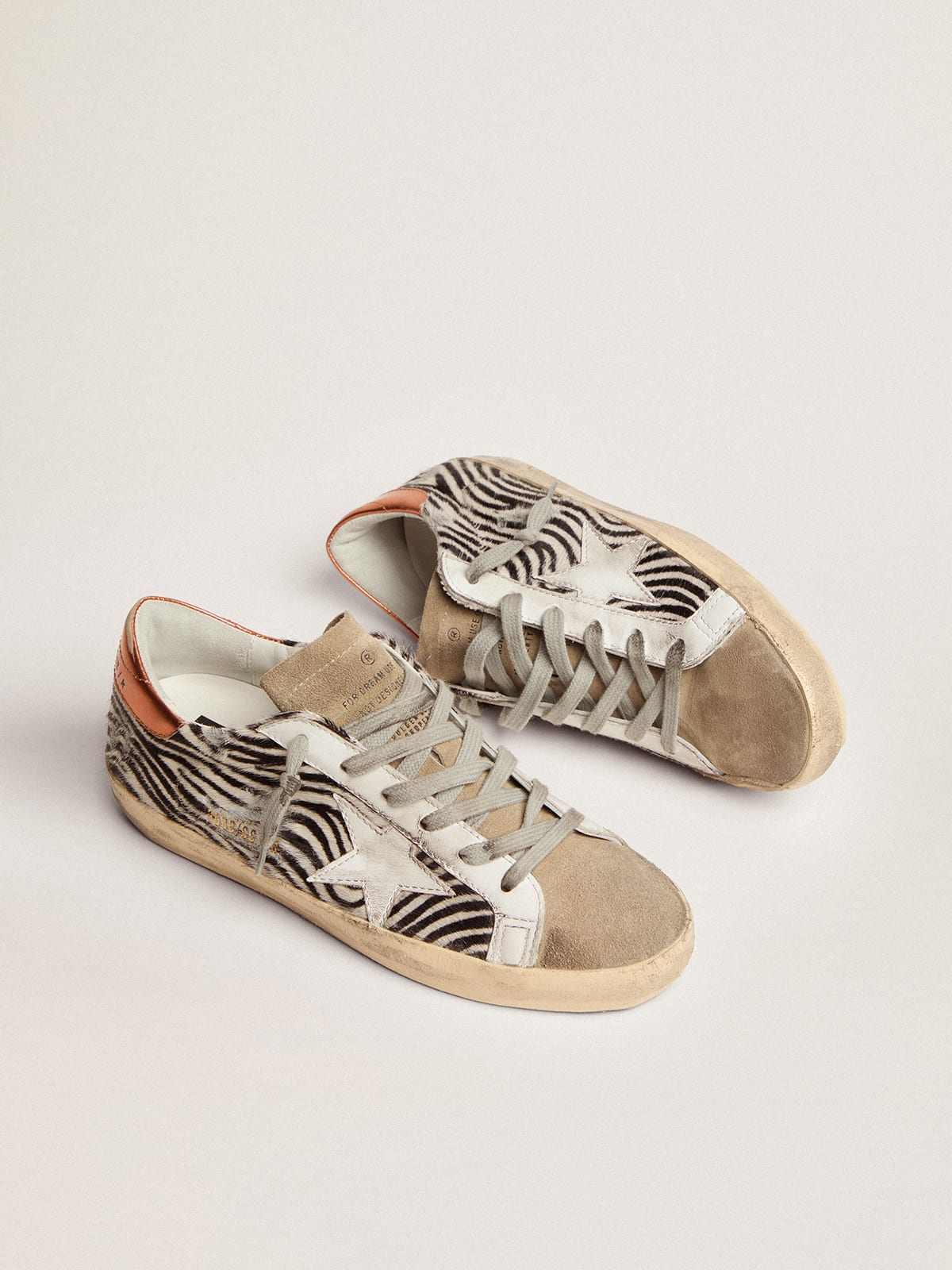 Sneaker Super-Star LTD in cavallino zebrato con stella in pelle bianca e talloncino in pelle laminata color arancione