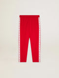 Pantalone jogging da donna di colore rosso con stelle rosse sui lati