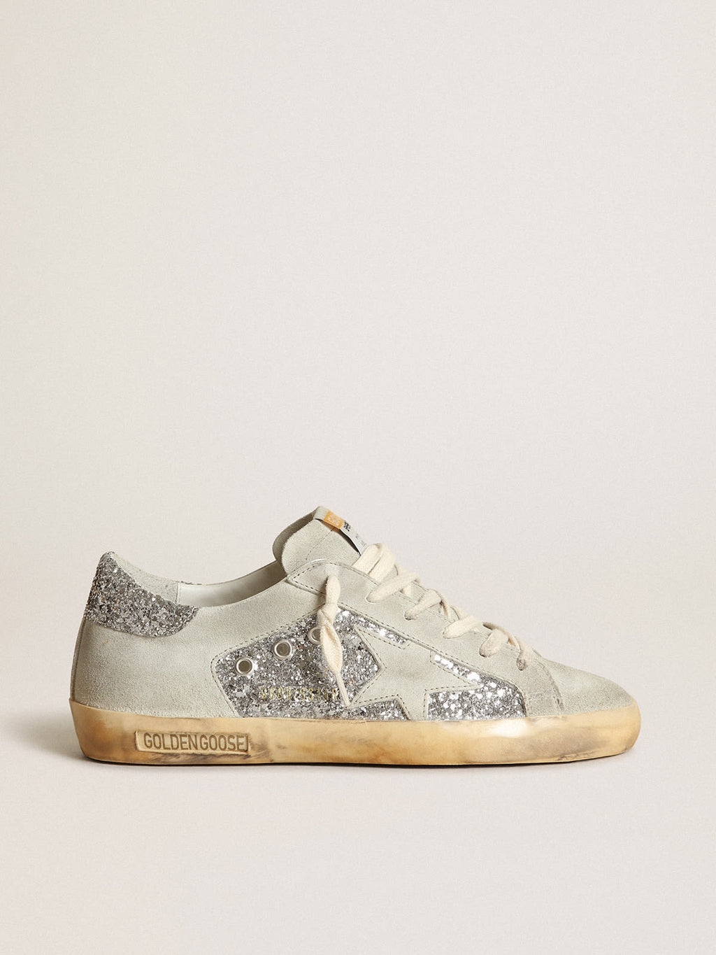 Sneaker Super-Star in glitter argento con stella e inserti in suede color grigio ghiaccio