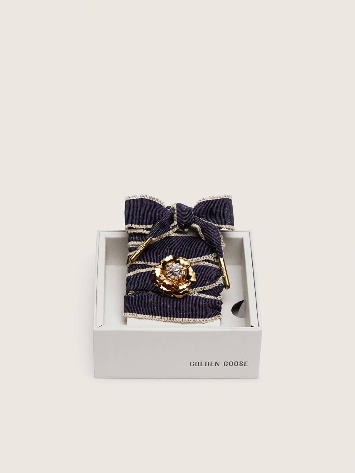 Skins "Sparkling" denim blue laces embellished with beige trim and a golden charm