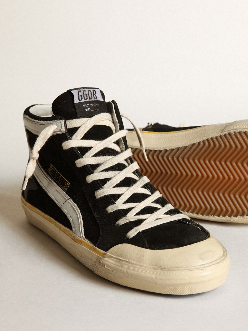 Sneaker Slide Penstar in suede nero con stella in pelle nera e virgola in pelle bianca