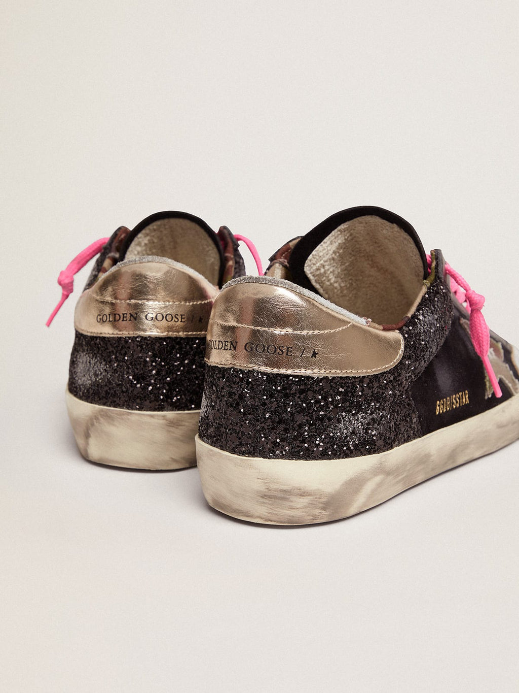 Sneaker Super-Star in glitter e suede neri con stella in tessuto camouflage