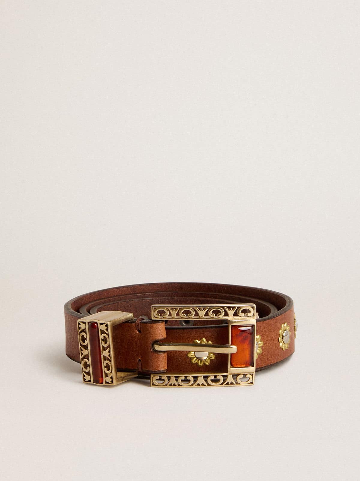 Brown leather belt with golden floral studs and amber inserts