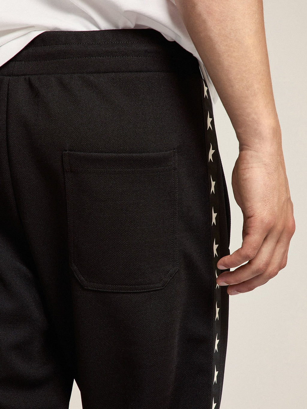 Pantalone jogging da uomo di colore nero con stelle bianche sui lati