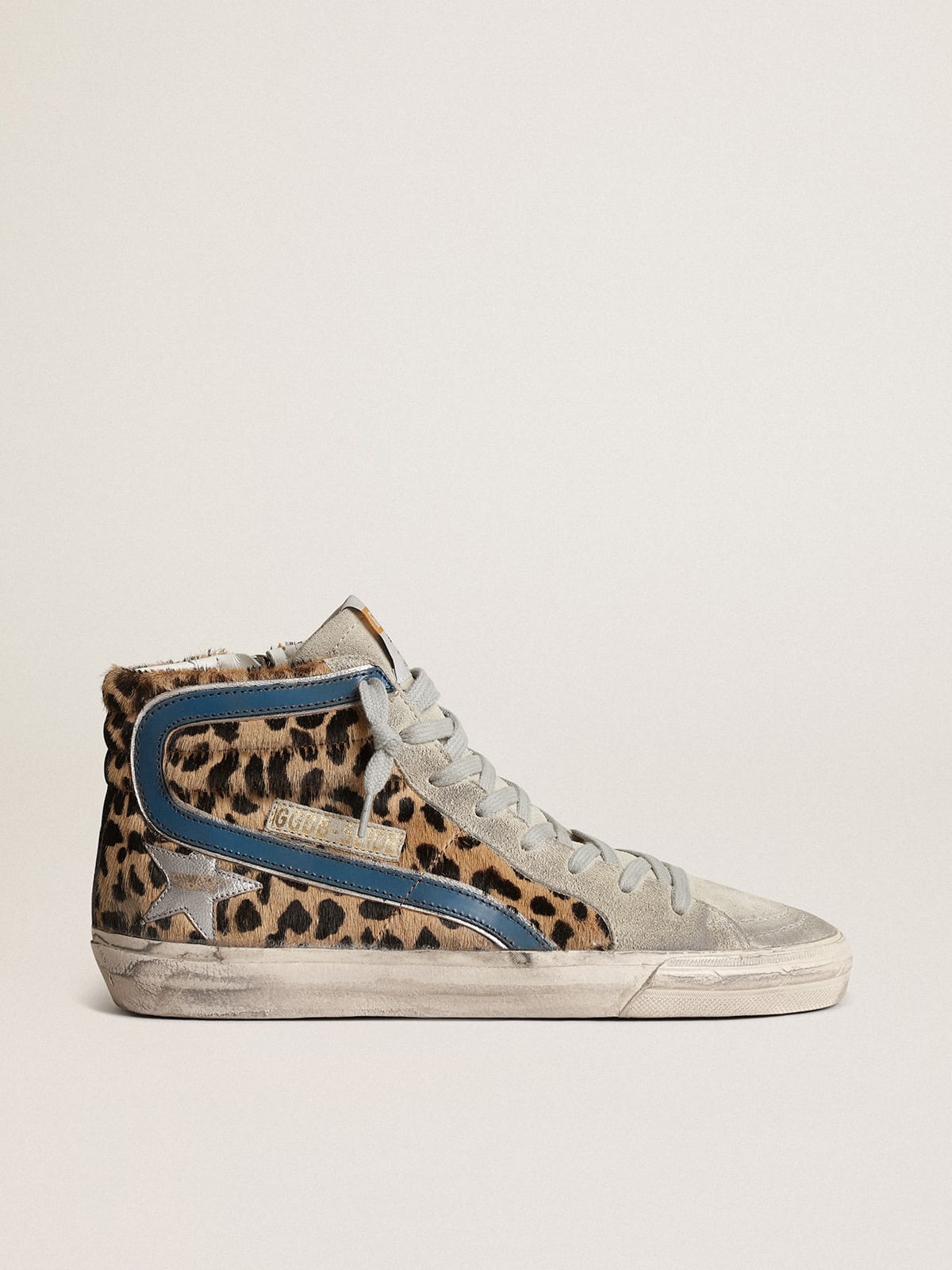 Slide in cavallino leopardato con stella in pelle laminata