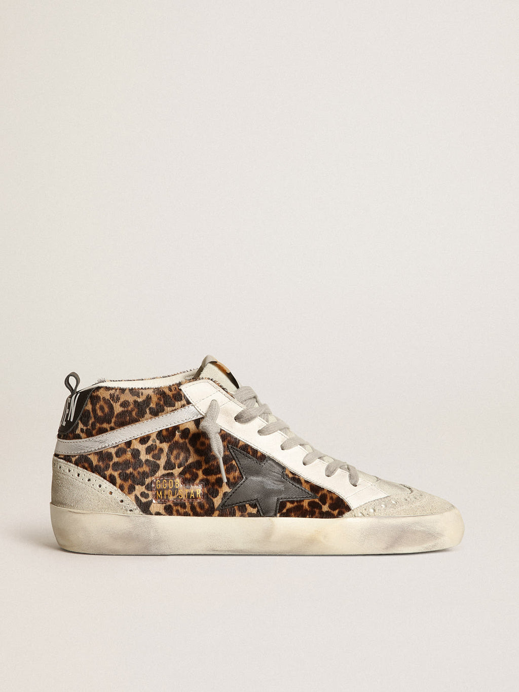 Sneaker Mid Star in cavallino leopardato con stella in pelle nera e virgola in pelle laminata color argento