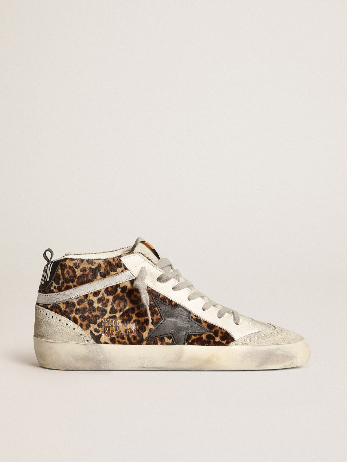 Sneaker Mid Star in cavallino leopardato con stella in pelle nera e virgola in pelle laminata color argento